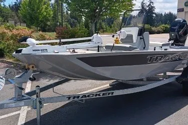 The Image of 2027 Tracker Bass Tracker Classic CC boat on trailer in parking lot. - 0
