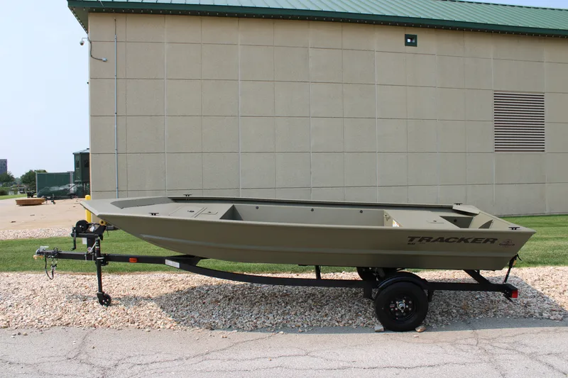 The Image of 2027 Tracker Grizzly 1648 Utility boat on trailer, parked outdoors. - 0