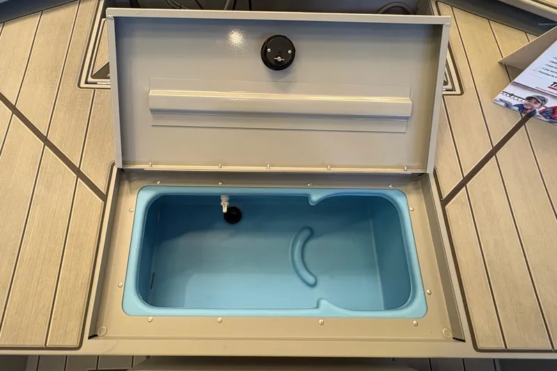 Slide: The Image of Open storage compartment on 2027 Tracker Bass Tracker Classic CC boat deck. - 14
