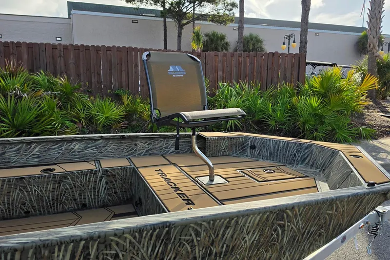 Slide: The Image of 2027 Tracker Grizzly 1756 T Marsh boat with camo design and elevated seat. - 14