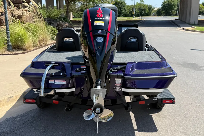 Slide: The Image of 2027 Nitro Z18 XL Pro boat with powerful outboard motor, parked outdoors. - 10