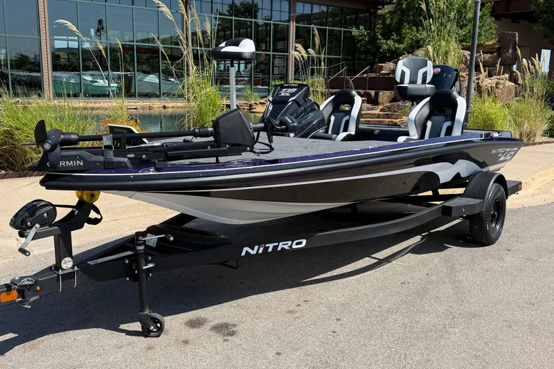 Slide: The Image of 2027 Nitro Z18 XL Pro fishing boat on trailer, parked outdoors. - 2