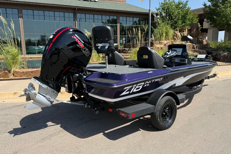 Slide: The Image of 2027 Nitro Z18 XL Pro boat with powerful outboard motor, parked outdoors. - 9