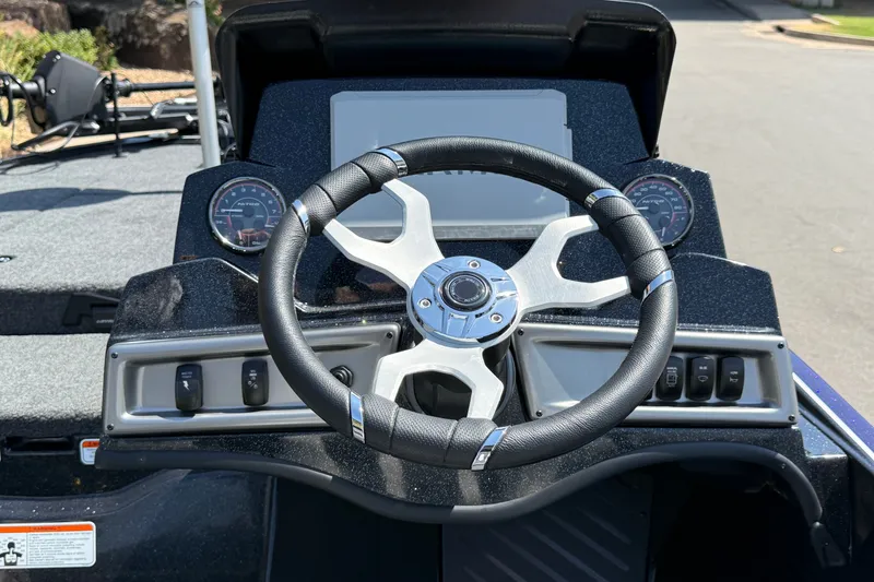 Slide: The Image of Steering console of 2027 Nitro Z18 XL Pro boat with modern controls and gauges. - 13