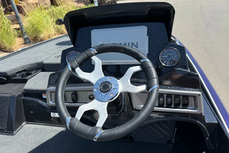 Slide: The Image of Steering wheel and dashboard of 2027 Nitro Z18 XL Pro boat with Garmin display. - 6