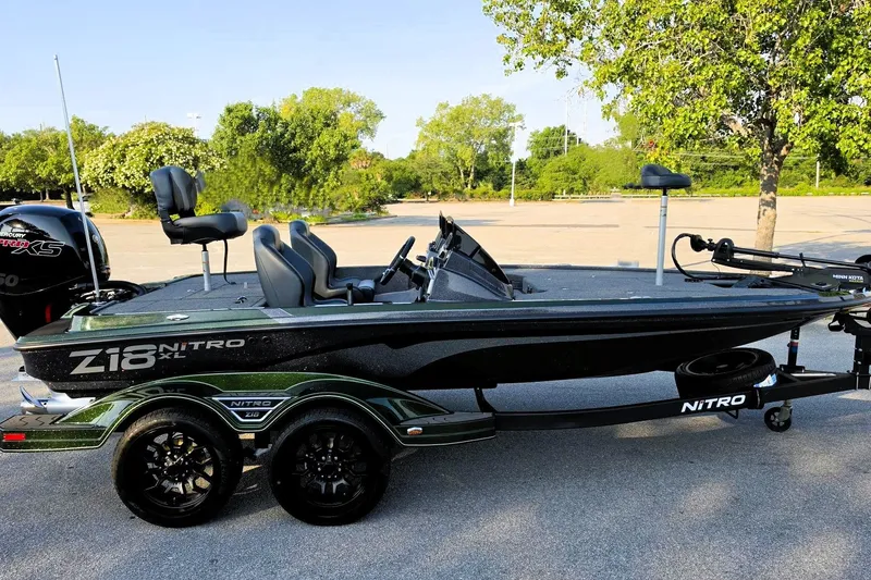 The Image of 2027 Nitro Z18 XL boat on trailer, parked outdoors, featuring sleek design and modern equipment. - 0
