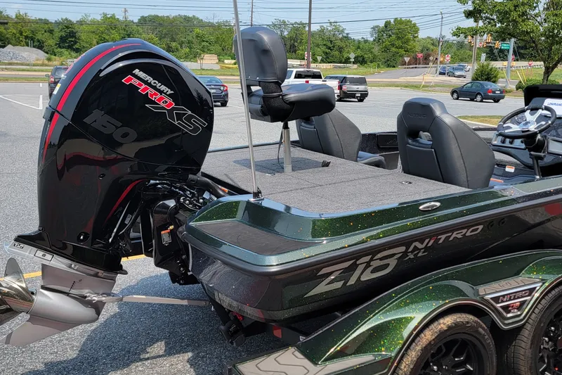 Slide: The Image of 2027 Nitro Z18 XL boat with Mercury Pro XS 150 engine in parking lot. - 3