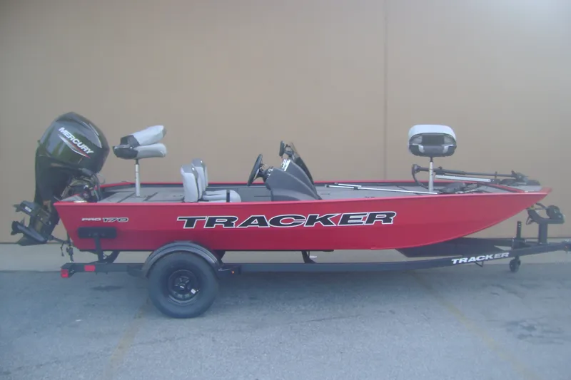 The Image of 2027 Tracker Pro 170 boat with Mercury engine, red exterior, on a trailer. - 0