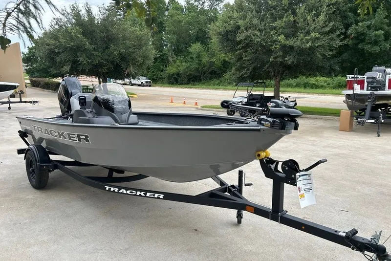 The Image of 2027 Tracker Super Guide V-16 SC boat on trailer in outdoor setting. - 0