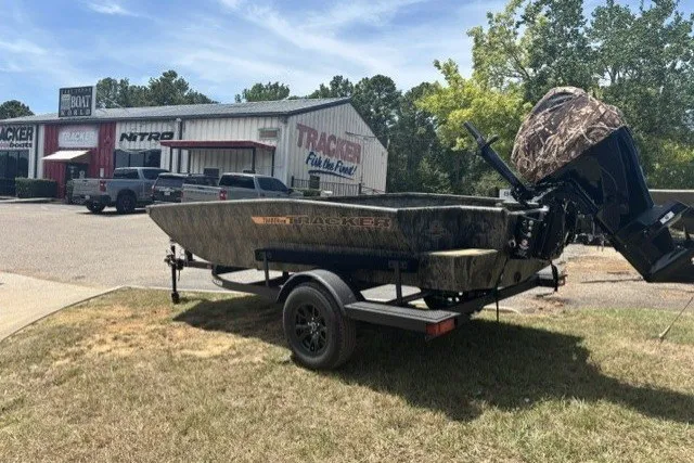 The Image of 2027 Tracker Grizzly 1553 Timber boat on trailer outside dealership. - 0