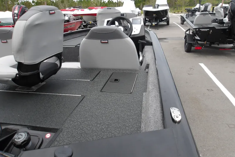 Slide: The Image of 2027 Tracker Pro Team 175 boat interior with gray seating and storage compartments. - 14