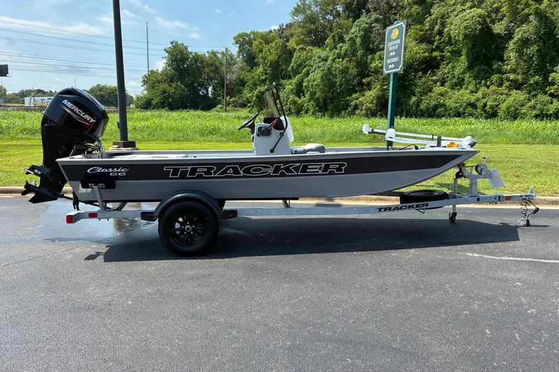 The Image of 2027 Tracker Bass Tracker Classic CC boat on trailer in parking lot. - 0