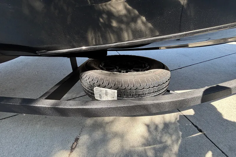 Slide: The Image of Spare tire under 2027 Tracker Pro Team 175 boat on trailer. - 33