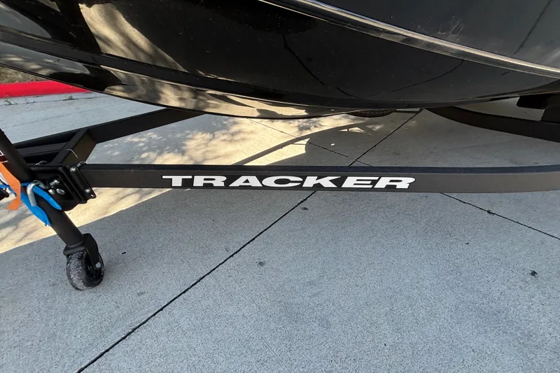 Slide: The Image of Trailer of 2027 Tracker Pro Team 175 boat on pavement. - 30