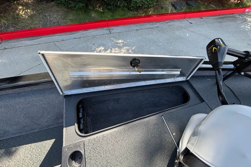 Slide: The Image of Open storage compartment on 2027 Tracker Pro Team 175 boat deck. - 16