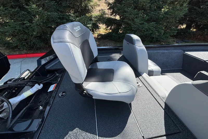 Slide: The Image of 2027 Tracker Pro Team 175 boat interior with gray seating and textured flooring. - 13