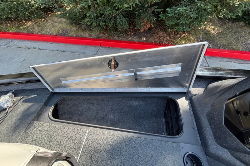 Slide: The Image of Open storage compartment on 2027 Tracker Pro Team 175 boat, showcasing interior space. - 17