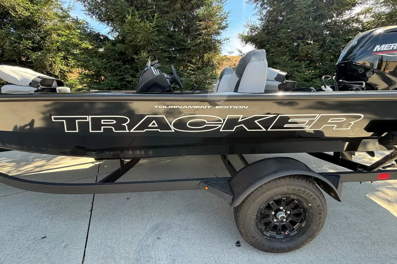 Slide: The Image of 2027 Tracker Pro Team 175 boat on trailer, side view with logo visible. - 69