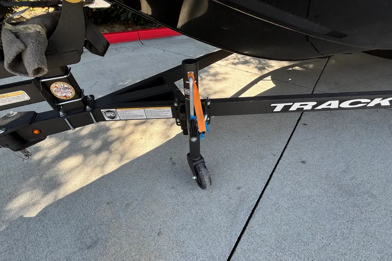 Slide: The Image of Trailer hitch of a 2027 Tracker Pro Team 175 boat on pavement. - 32
