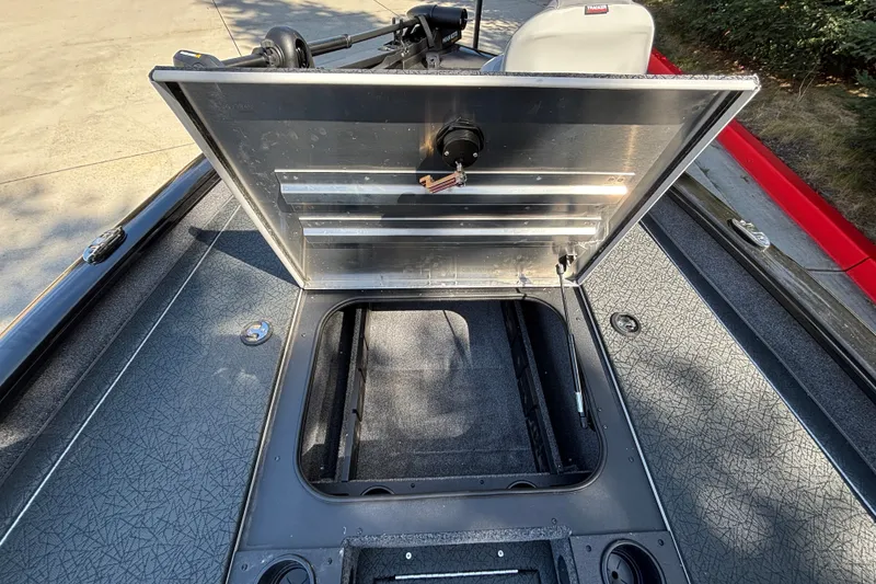Slide: The Image of Open storage compartment on 2027 Tracker Pro Team 175 boat, showcasing interior space. - 15