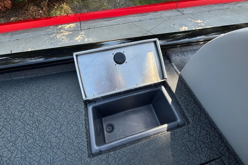 Slide: The Image of Open storage compartment on 2027 Tracker Pro Team 175 boat deck. - 18