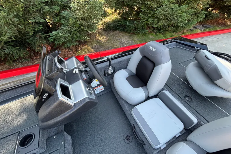 Slide: The Image of 2027 Tracker Pro Team 175 boat interior with steering wheel and seating. - 14