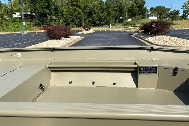 Slide: The Image of 2027 Tracker Grizzly 1553 Timber boat interior, showcasing spacious storage and seating area. - 13