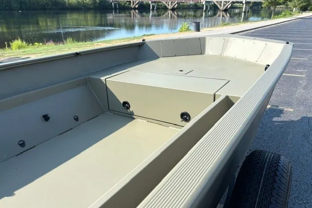 Slide: The Image of 2027 Tracker Grizzly 1553 Timber boat interior by a riverside. - 18