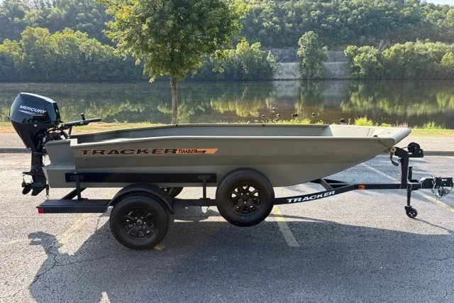 The Image of 2027 Tracker Grizzly 1553 Timber boat on trailer by a scenic river. - 16