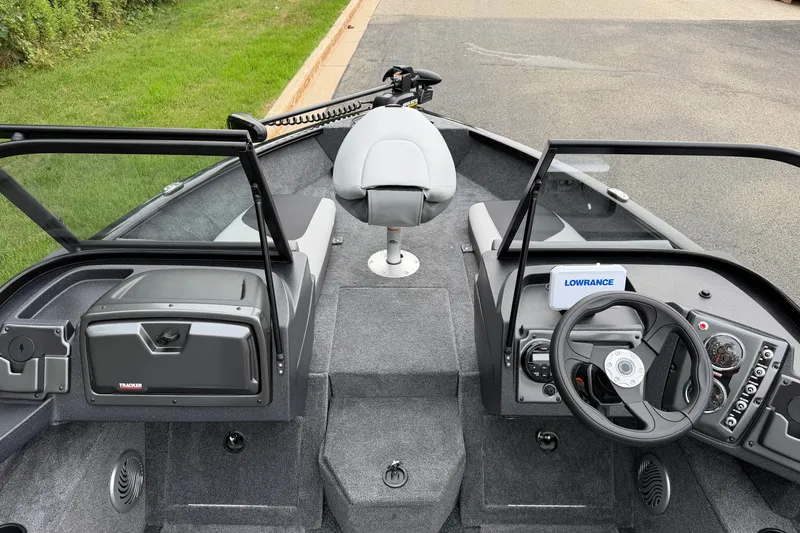 Slide: The Image of 2027 Tracker Pro Guide V-175 Combo boat interior with steering console and seating. - 21
