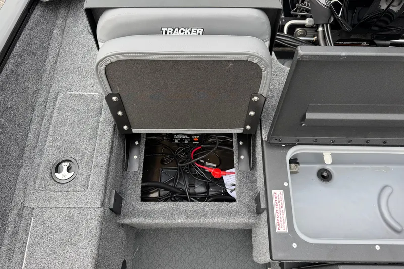Slide: The Image of 2027 Tracker Pro Guide V-175 Combo boat interior with storage compartment open. - 15