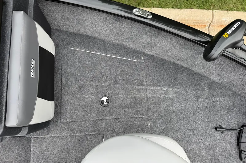 Slide: The Image of Interior of 2027 Tracker Pro Guide V-175 Combo boat with gray carpet and seating. - 28