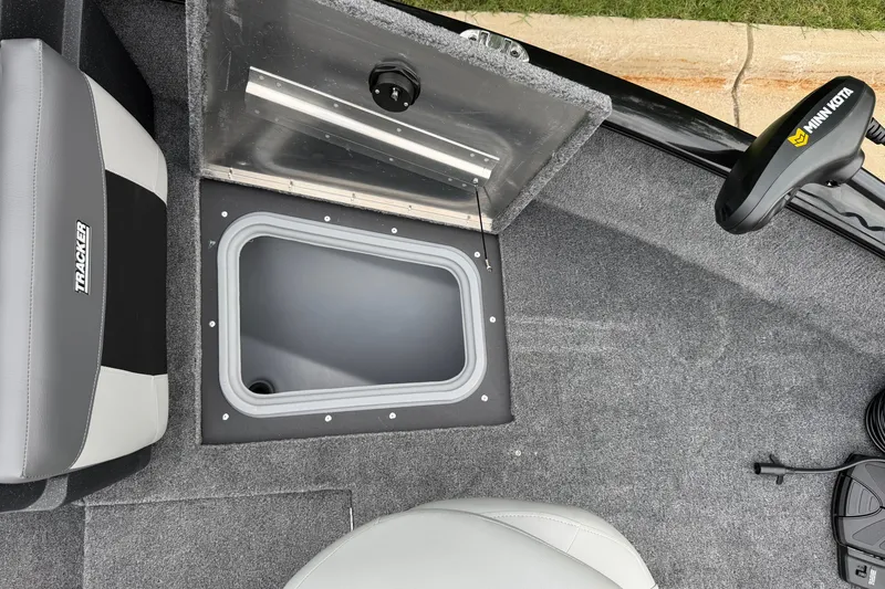 Slide: The Image of 2027 Tracker Pro Guide V-175 Combo boat interior with storage compartment and Minn Kota trolling motor. - 29