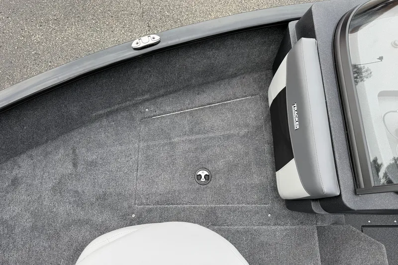 Slide: The Image of 2027 Tracker Pro Guide V-175 Combo boat interior with gray carpet and seating. - 26