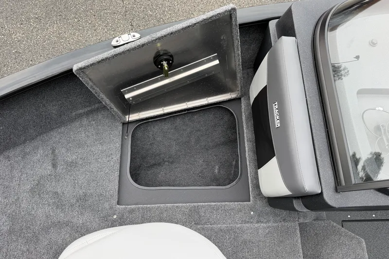 Slide: The Image of 2027 Tracker Pro Guide V-175 Combo boat interior with open storage compartment and seating. - 27