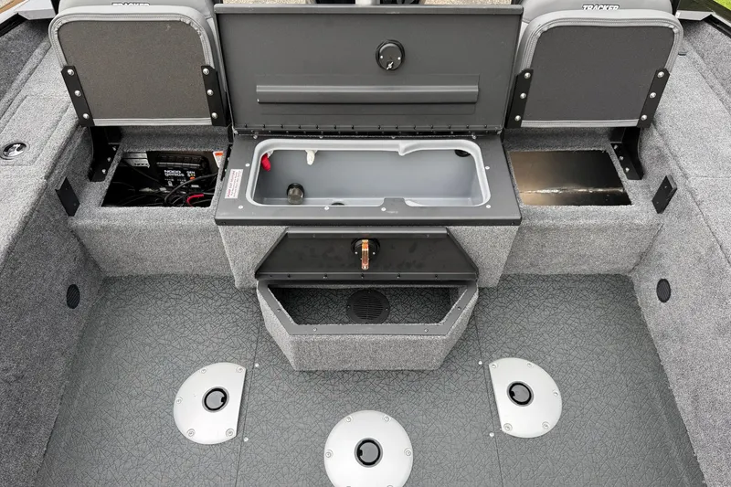 Slide: The Image of Interior of 2027 Tracker Pro Guide V-175 Combo boat with storage compartments open. - 14