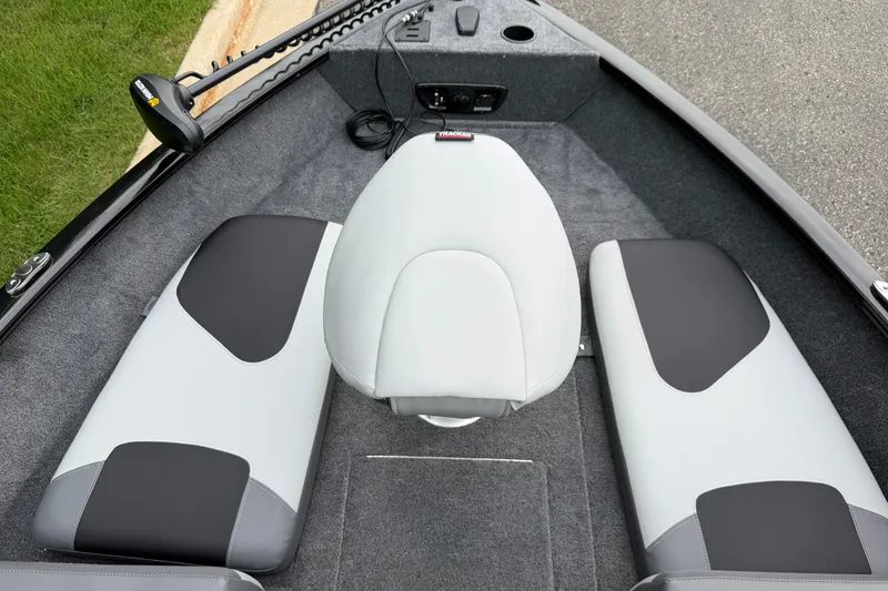 Slide: The Image of 2027 Tracker Pro Guide V-175 Combo boat interior with gray and black seating. - 25