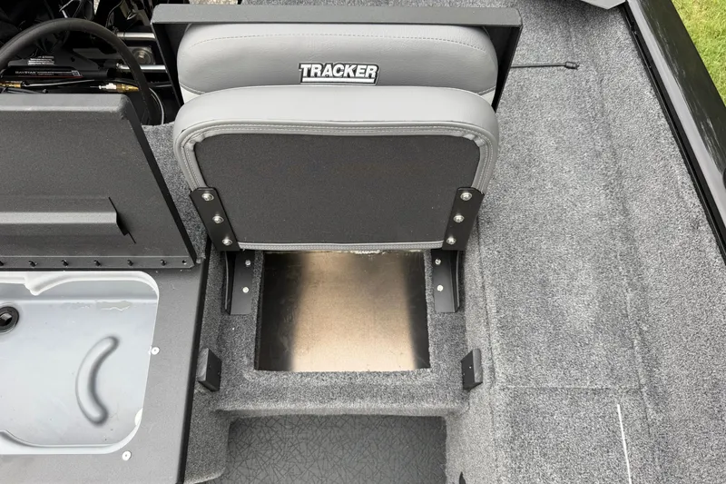 Slide: The Image of 2027 Tracker Pro Guide V-175 Combo boat interior with gray seating and storage compartment. - 16