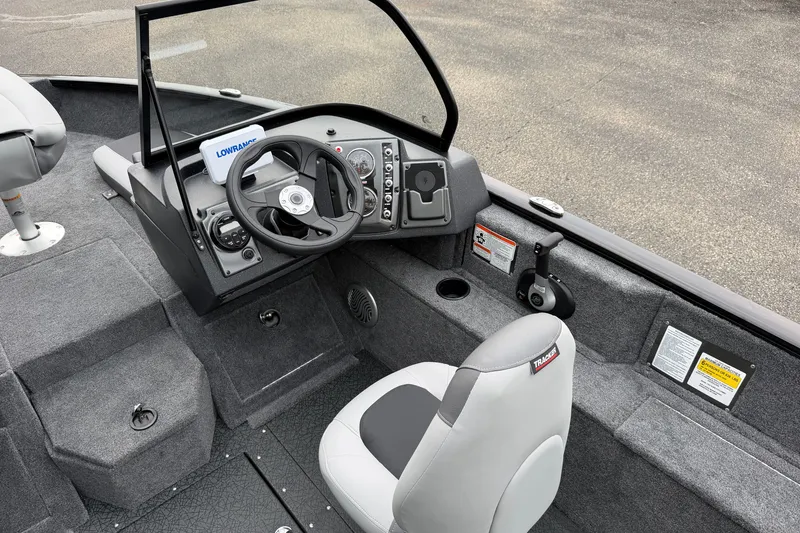 Slide: The Image of 2027 Tracker Pro Guide V-175 Combo boat interior with steering console and seating. - 18