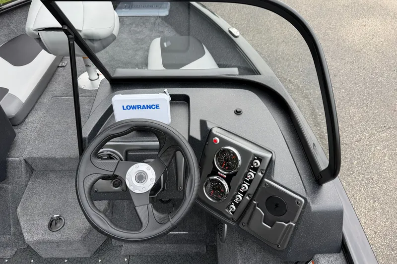 Slide: The Image of 2027 Tracker Pro Guide V-175 Combo boat dashboard with steering wheel and Lowrance device. - 17