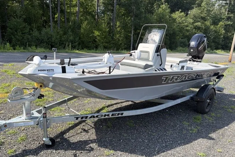 The Image of 2027 Tracker Bass Tracker Classic CC boat on trailer, parked outdoors. - 0