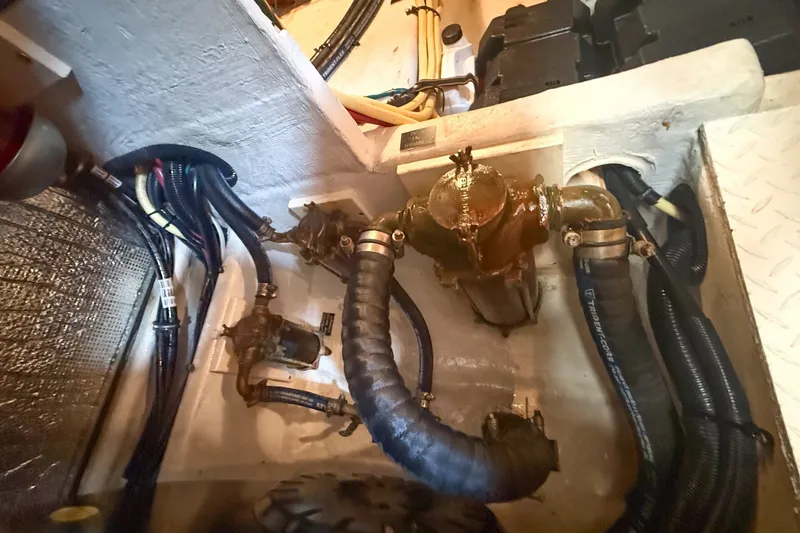 Slide: The Image of Engine compartment of 2007 Cruisers Yachts 455 Express Motoryacht with hoses and wiring. - 16