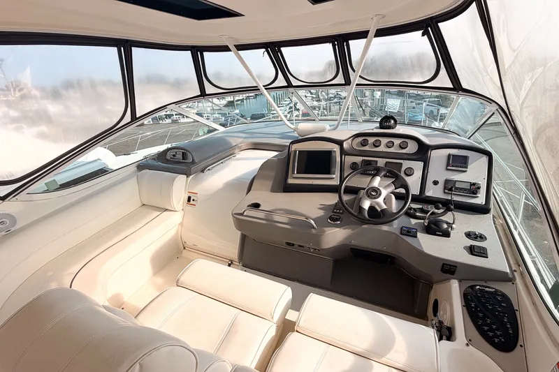 Slide: The Image of 2007 Cruisers Yachts 455 Express Motoryacht helm with modern controls and panoramic windows. - 5