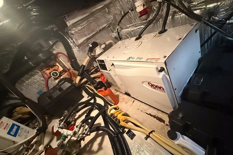Slide: The Image of Engine room of 2007 Cruisers Yachts 455 Express Motoryacht with generator and wiring. - 14