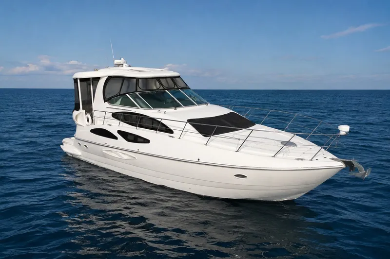 The Image of 2007 Cruisers Yachts 455 Express Motoryacht on open sea under clear sky. - 0