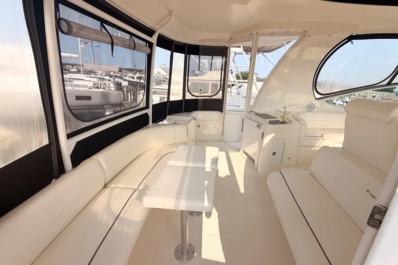 Slide: The Image of 2007 Cruisers Yachts 455 Express Motoryacht interior with spacious seating and panoramic windows. - 9