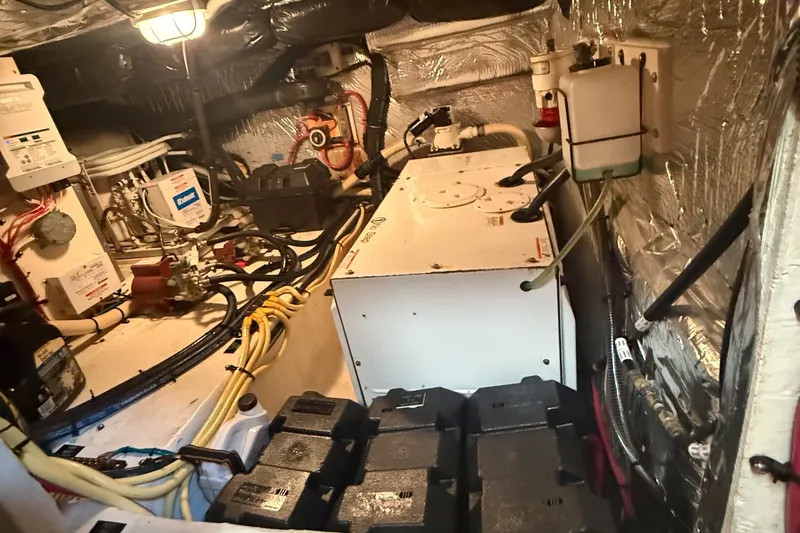 Slide: The Image of Engine room of 2007 Cruisers Yachts 455 Express Motoryacht with wiring and equipment. - 12