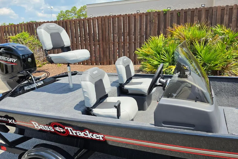 Slide: The Image of 2027 Tracker Bass Tracker Classic XL boat with seating and Mercury engine. - 13