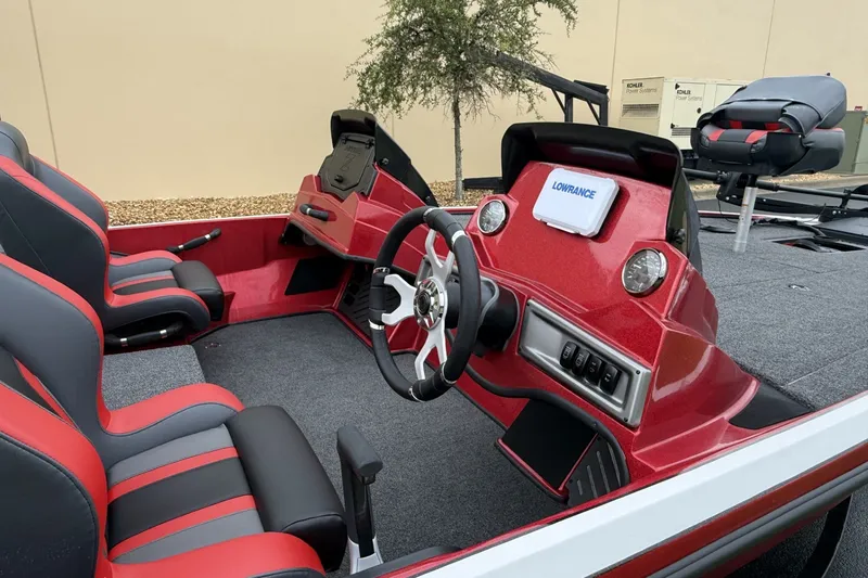 Slide: The Image of Interior of 2027 Nitro Z18 XL boat with red and black seating, steering wheel, and Lowrance display. - 4