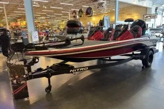 Slide: The Image of 2027 Nitro Z18 XL boat displayed indoors, featuring sleek design and vibrant red accents. - 1